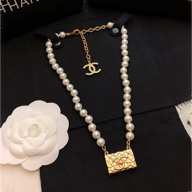 18K Chanel Pearl Bag Pendant Necklace