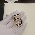 18K Chanel No.5 Leather Diamond Brooch
