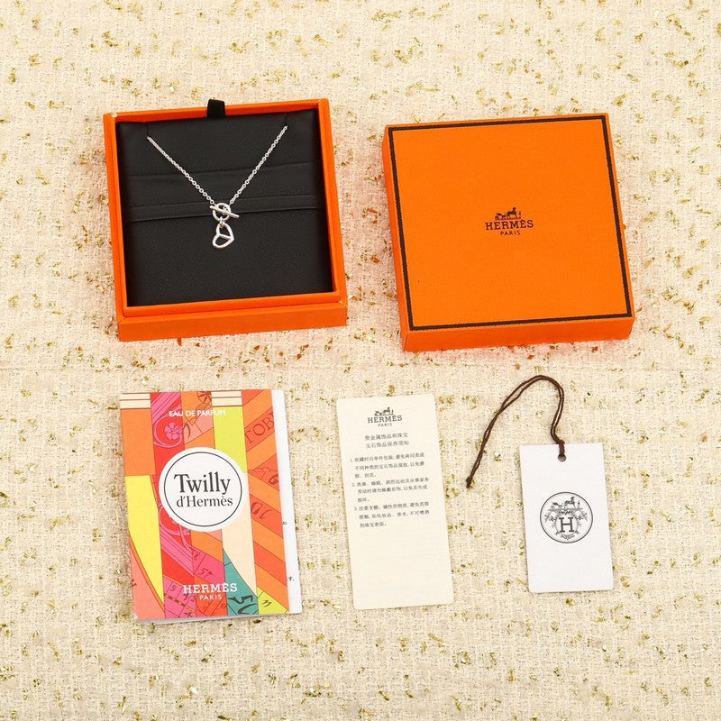 18K Hermès Cache Celine Amulette Pendant Necklace