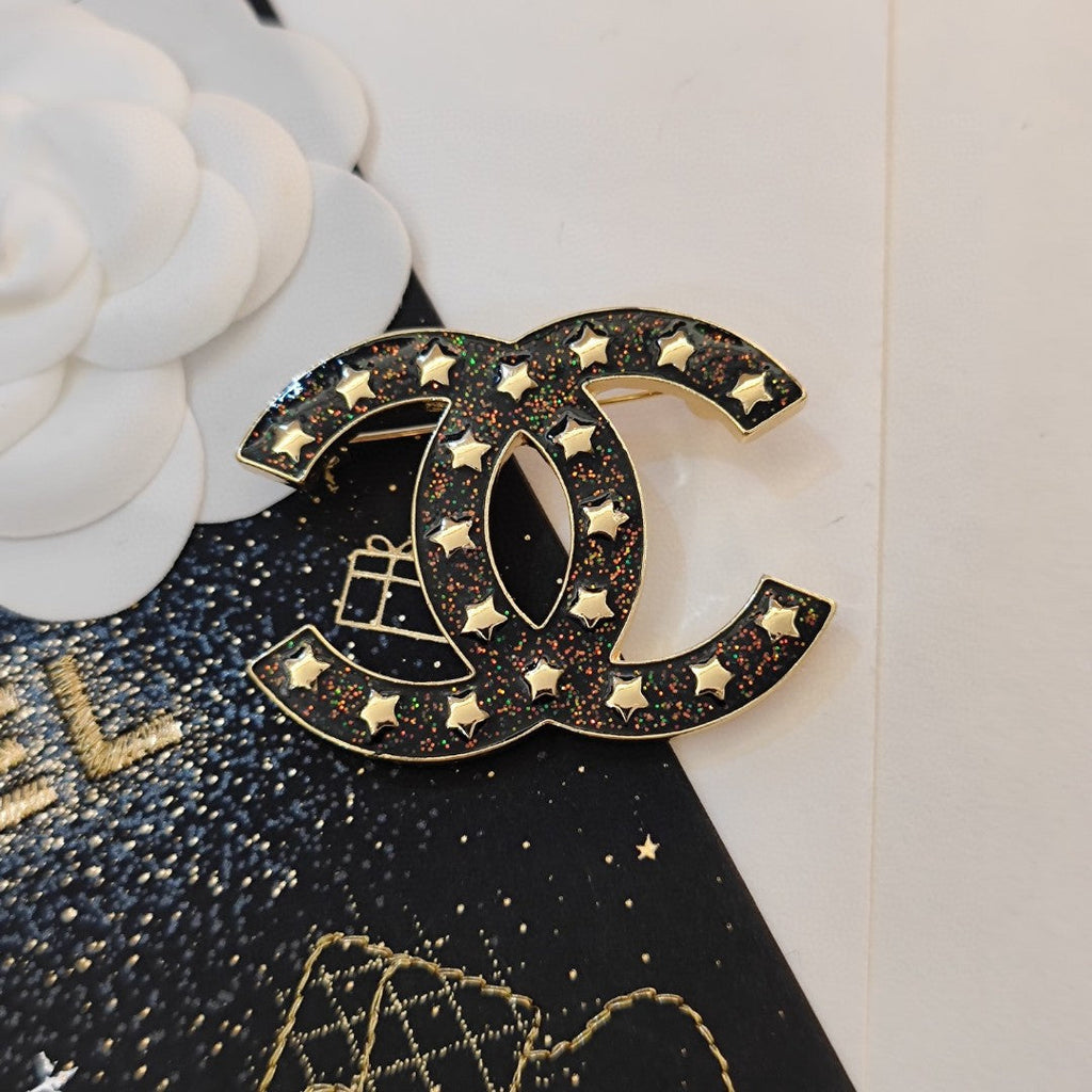 18K Chanel Black Star Brooch