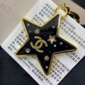 18K Chanel Black Gold Star Brooch