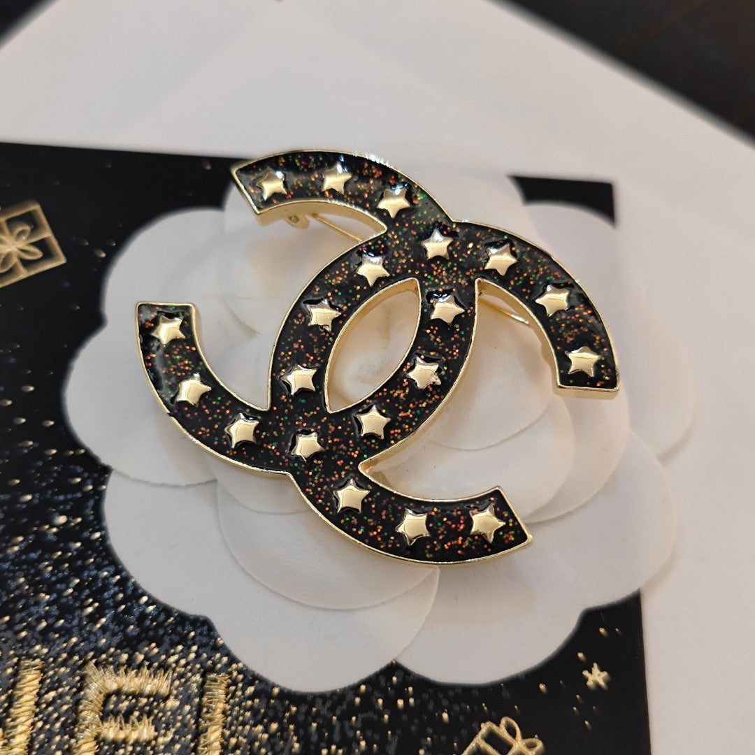18K Chanel Black Star Brooch