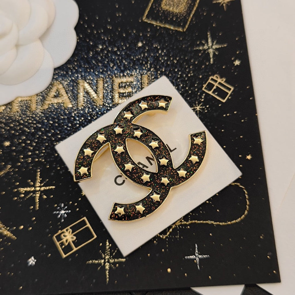 18K Chanel Black Star Brooch