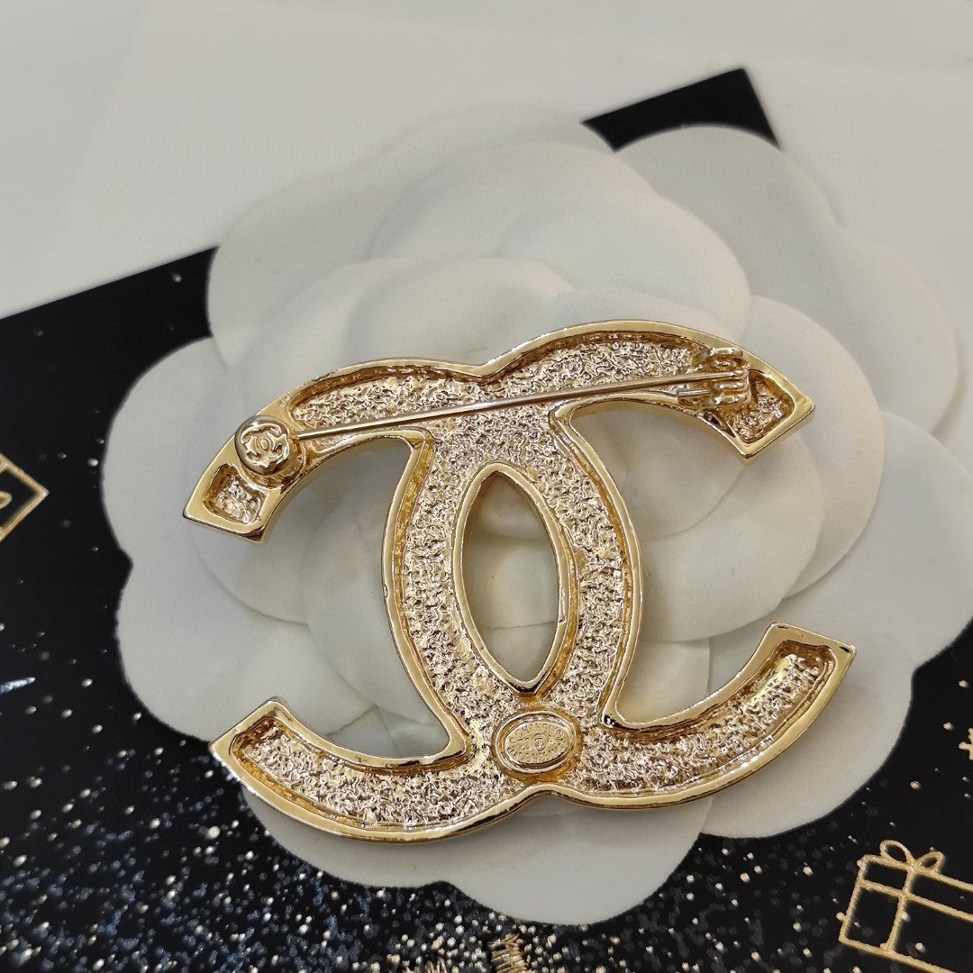 18K Chanel Black Star Brooch