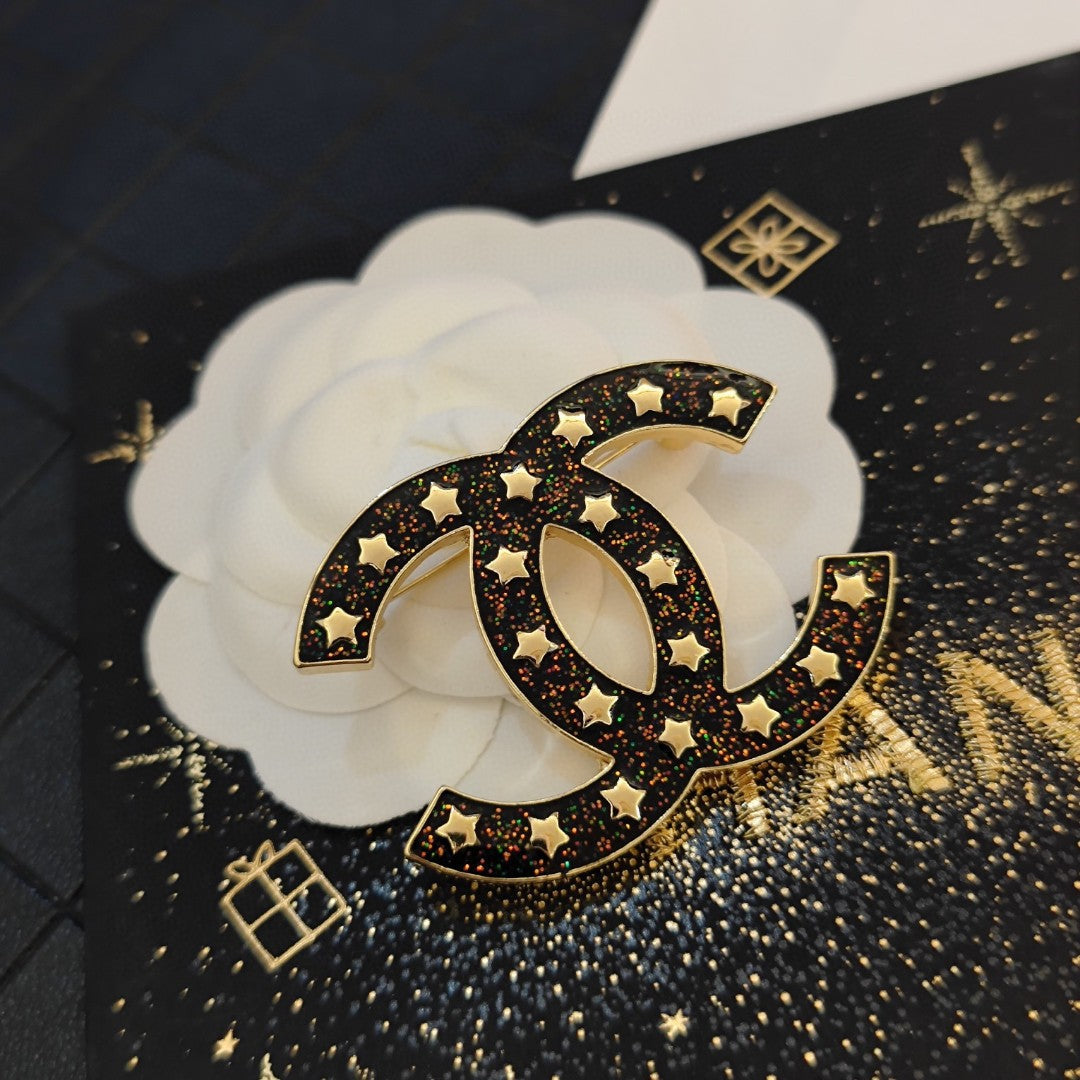18K Chanel Black Star Brooch