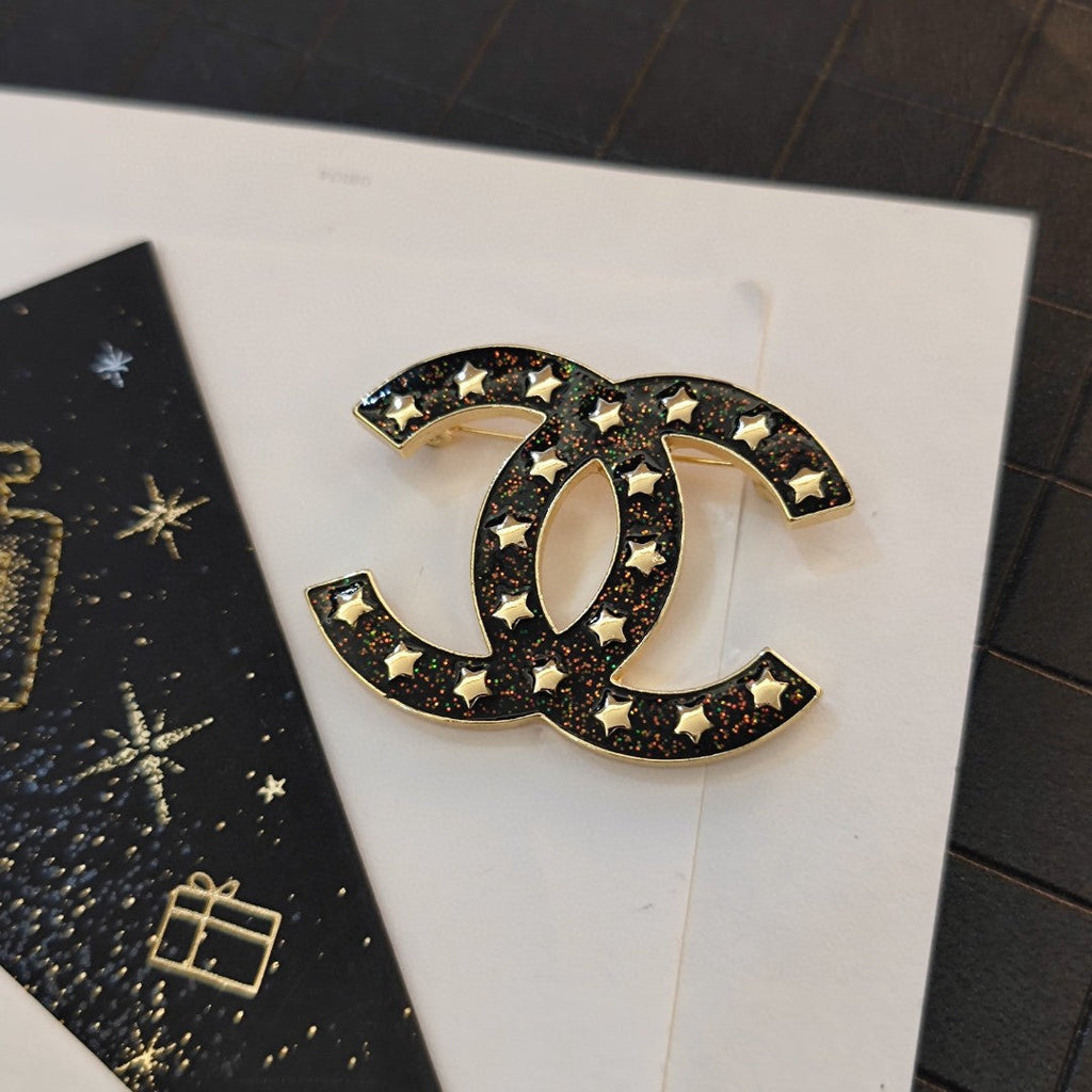18K Chanel Black Star Brooch
