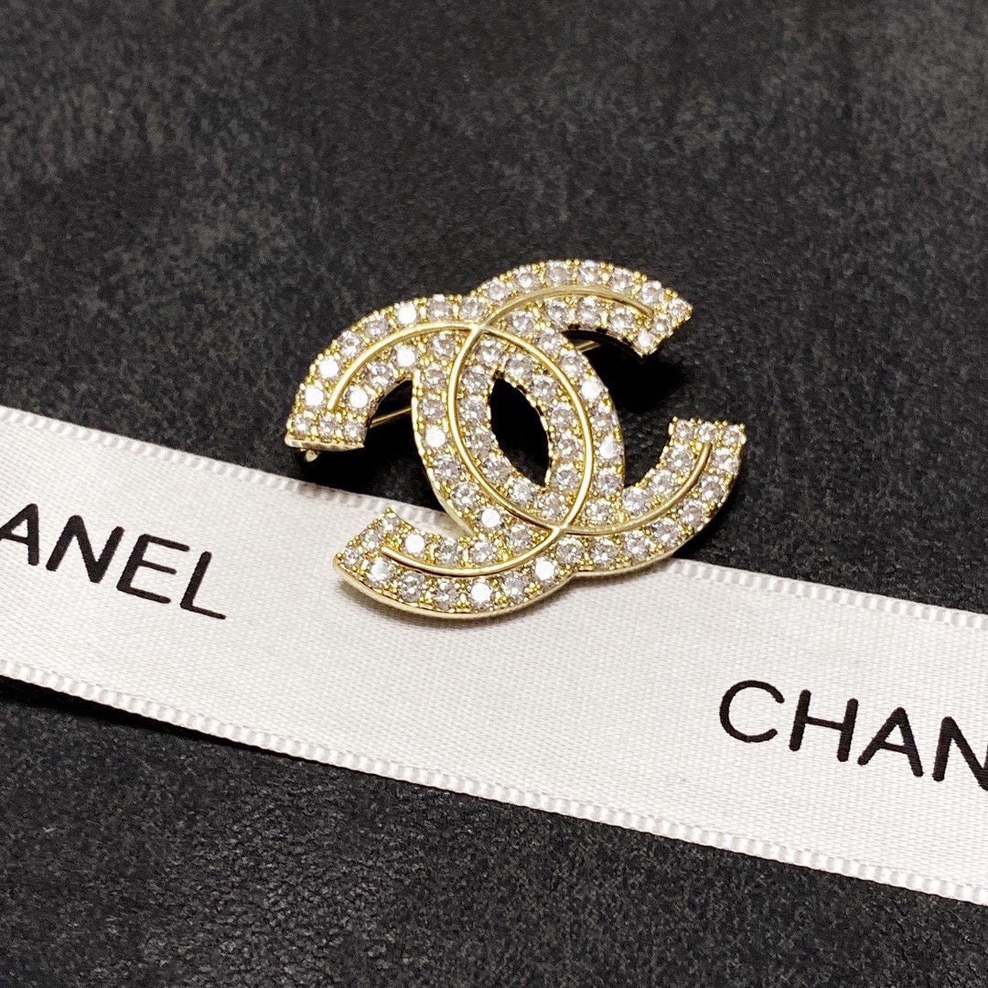 18K Chanel Diamonds Set Broochs
